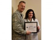Major General Anthony P. German, commander of the New York Air National Guard, presents Helen Krajick, manager of the operating room at St. Peter’s Hospital, with the Patriot Award in recognition of her support of an employee in the U.S. Armed Forces.