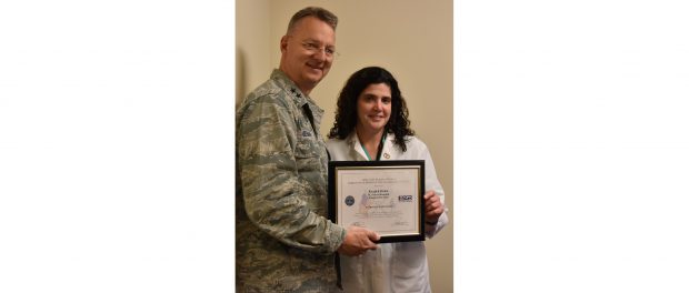 Major General Anthony P. German, commander of the New York Air National Guard, presents Helen Krajick, manager of the operating room at St. Peter’s Hospital, with the Patriot Award in recognition of her support of an employee in the U.S. Armed Forces.