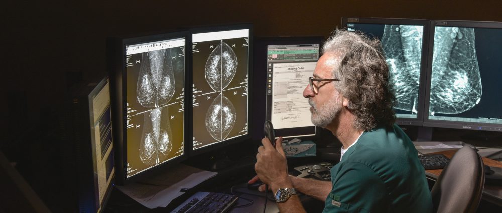 Dr. Andrew Warheit examines a medical image at the St. Peter's Hospital Breast Center in Albany, New York.