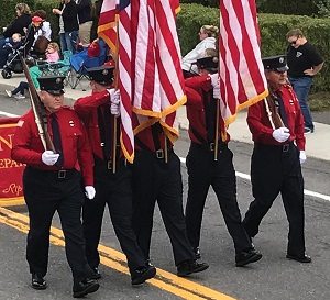 Pictured far right, Ed Synan was able to march in his community parade thanks to his remarkable rehabilitation following a spinal cord injury.